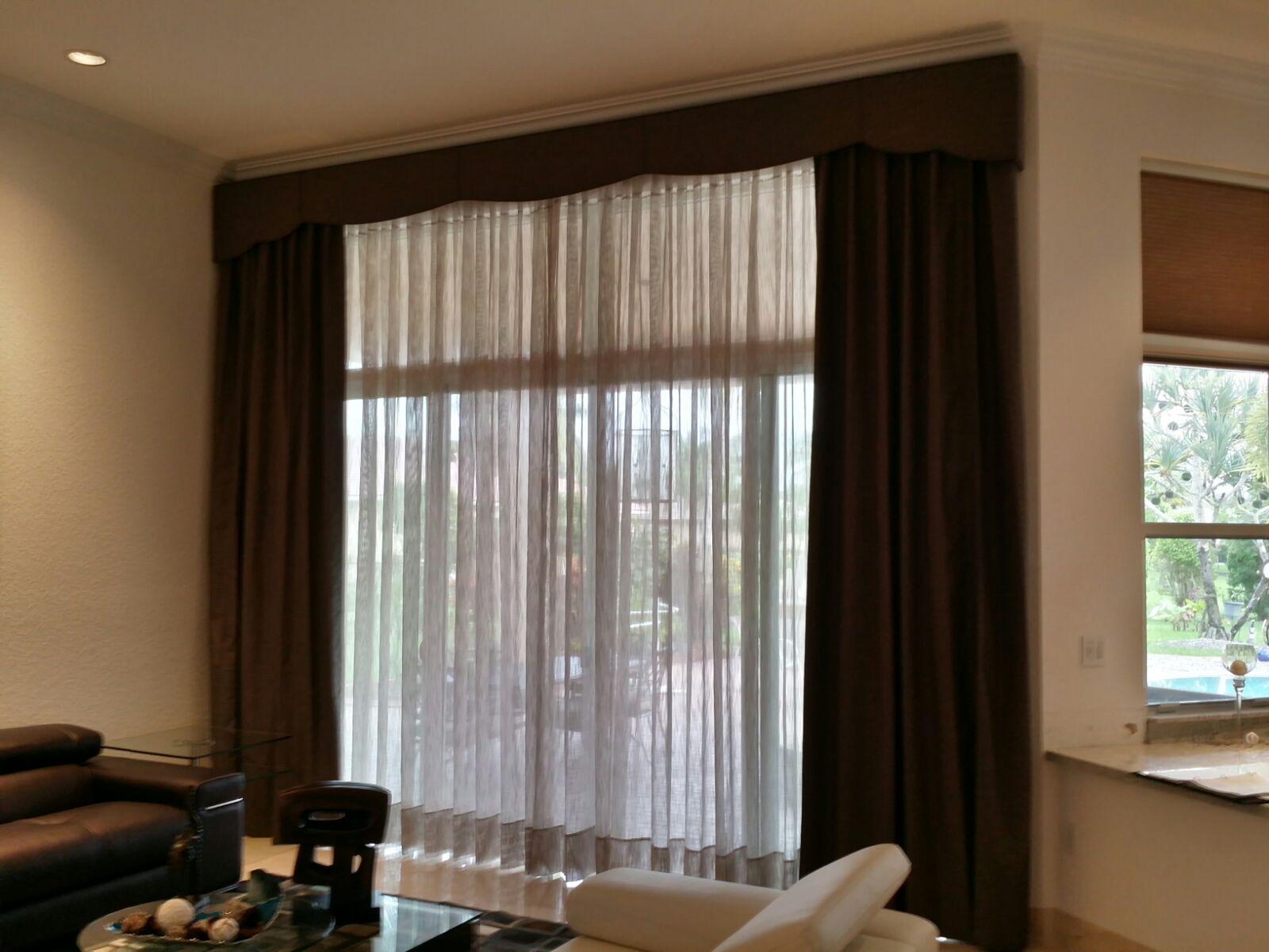 Custom drapery layered with sheer curtains