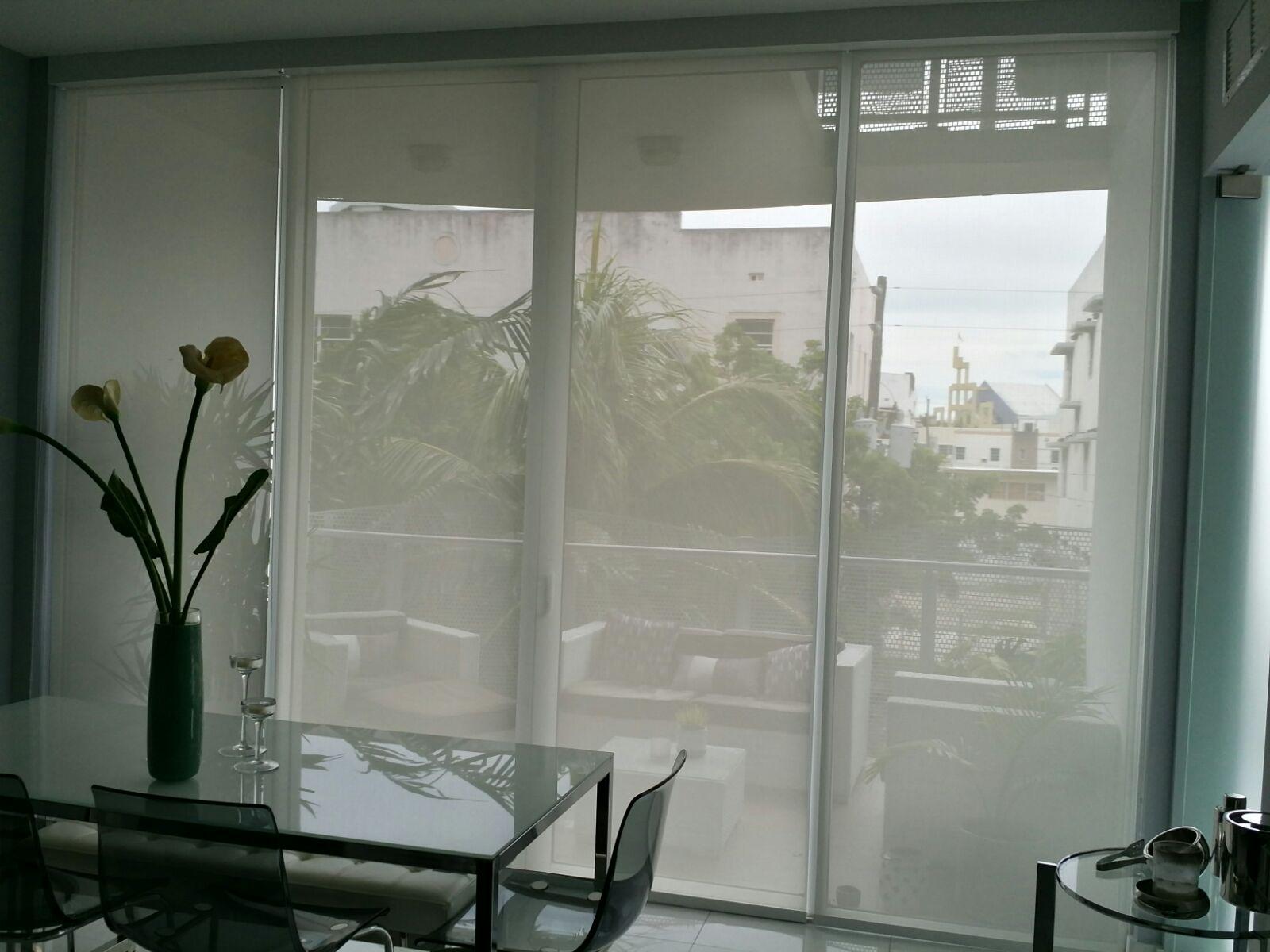 Roller shades installed across large windows